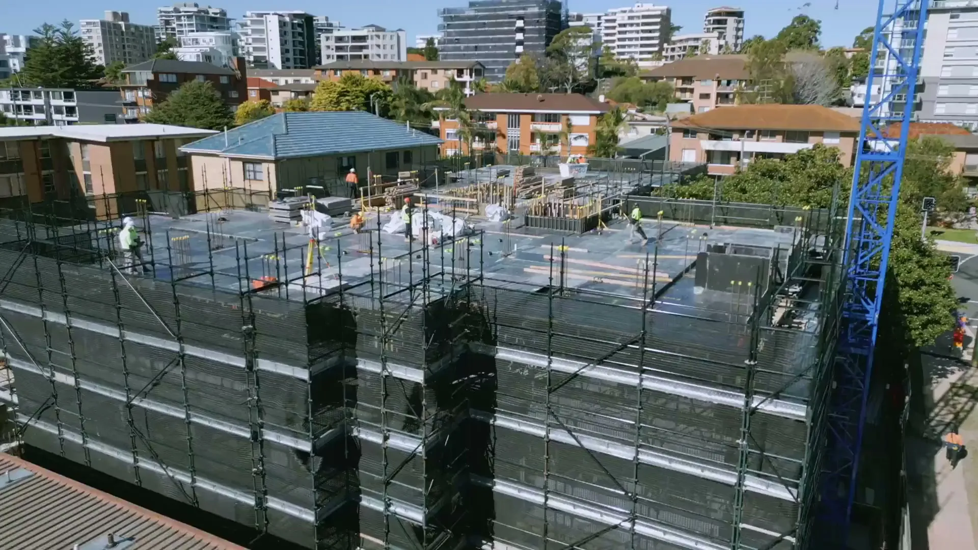 Formwork deck on a scaffolded apartment building in Sydney